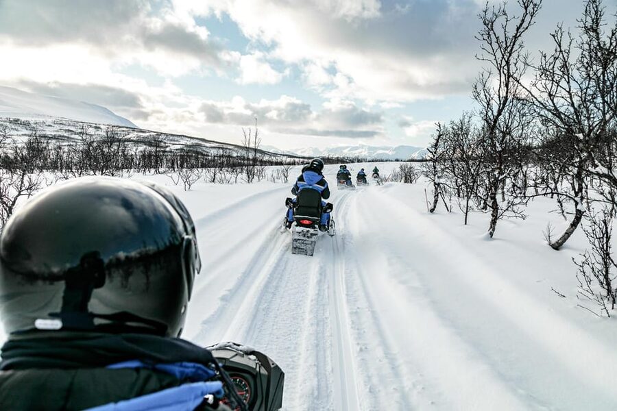 Lyngen: Snowmobile Safari with Lunch in seaside Restaurant - Gear up correctly, then let the guide handle the hard parts