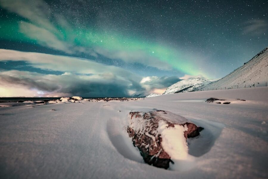 Lyngenalps: Northern Lights Snowmobile Safari - Riding the Lyngenalps at night, where the aurora hunt actually has motion