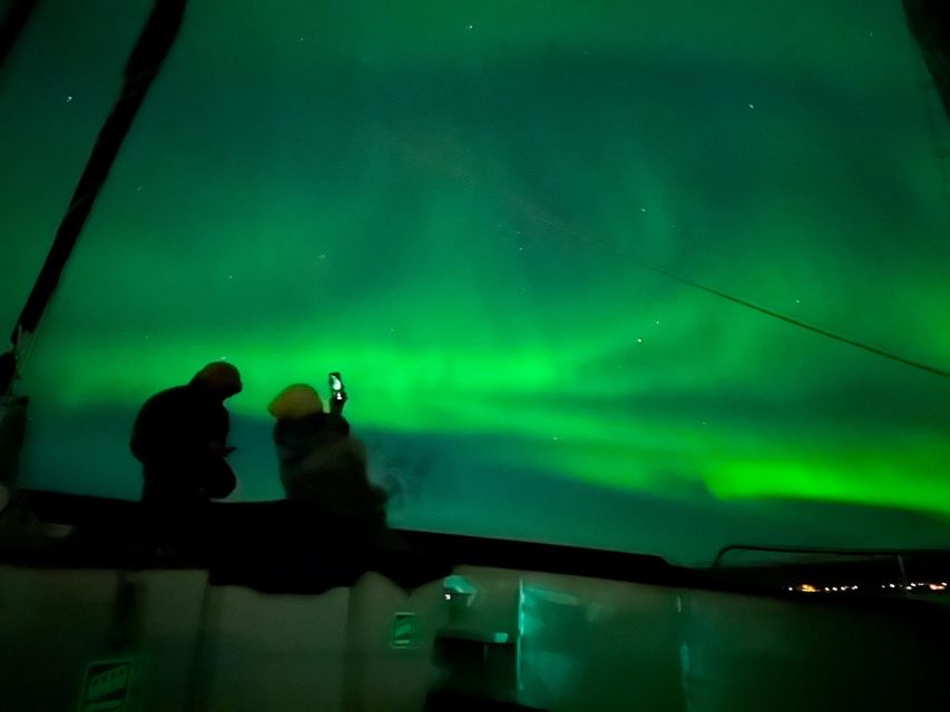 Tromso: Luxury Northern Lights Cruise with Hot Tub & Dinner - Finding the aurora from a hot tub in the Arctic cold