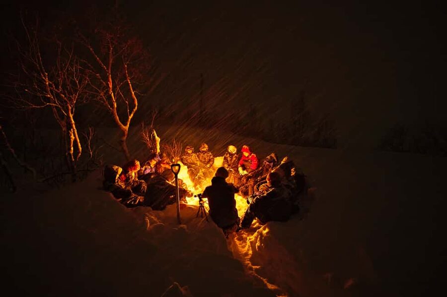Tromsø: Small Group Northern Lights Hunt - Campfire warmth, hot stew, and keeping your energy up